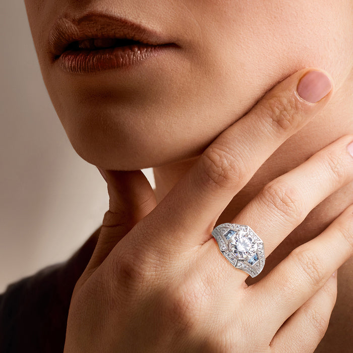 Sterling silver ring with clear center stone and geometric halo