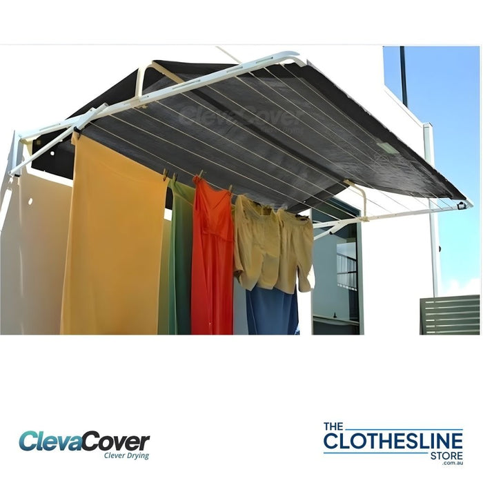 Fold Down Clothesline installed onto a house wall with washing hanging from the lines.   Clothesline Cover is installed for added protection from the elements.