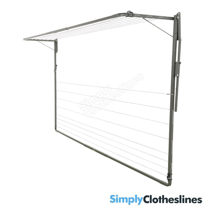 Austral Add-A-Line fold down clothesline shown from an angled side view the smallest frame is fully open/extended with the largest frame folded flat against a white wall.