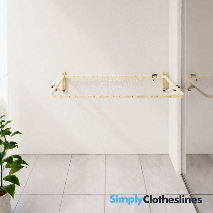 Austral Balcony Line clothesline folded extended fully open on an external balcony wall of an apartment.