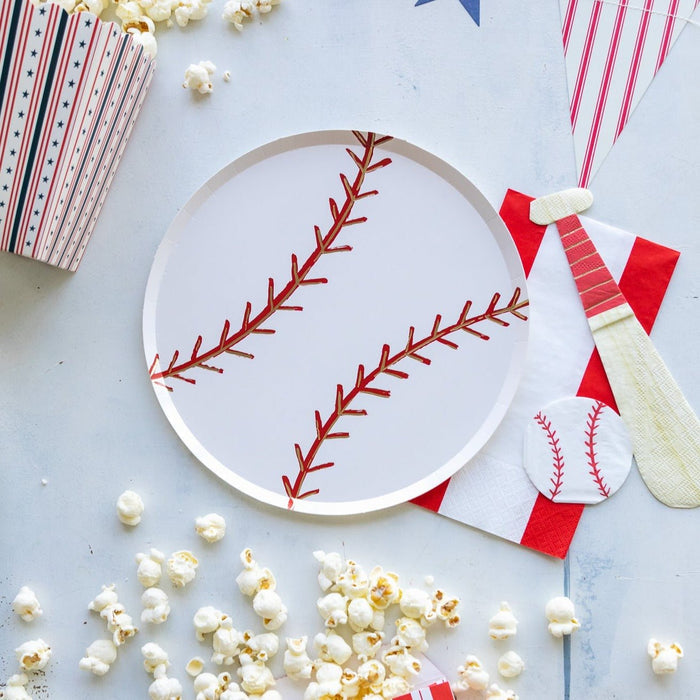 Baseball napkins styled at a sports party table with coordinating baseball plates and cups