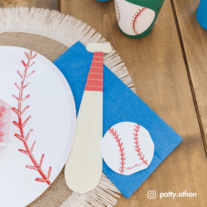 Baseball napkins at a baseball-themed birthday party table with diamond field decor and pennants