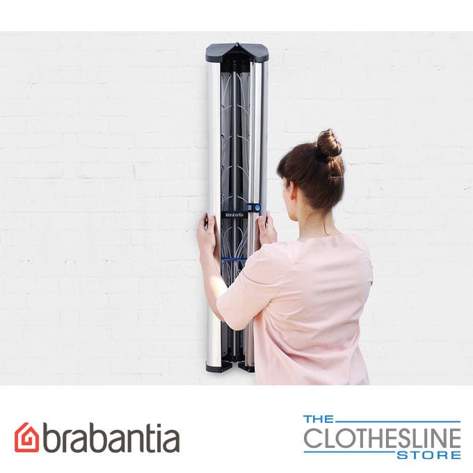 Brabantia WallFix 24m clothesline closed inside stainless cover mounted to exterior wall.