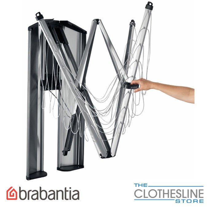Brabantia WallFix 24m clothesline showing folding arm mechanism in stainless steel frame.