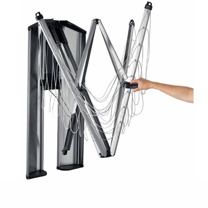 Brabantia WallFix Fold Away Clothesline, the stainless steel cover is open a persons hand to on the handle and showing how to open the clothesline.