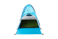 Blue waterproof pop-up tent sheltering a DoggieLawn real grass potty patch for dogs.