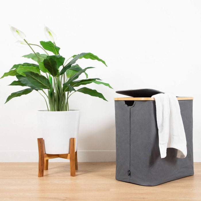 Bamboo Laundry Hamper on a bench by The Clothesline Store