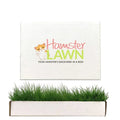 HamsterLawn Petite real grass pad with branded packaging and fresh green grass growing from the tray.