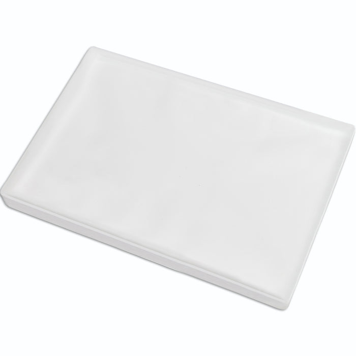White silicone dog grass pad tray with raised edges, shown empty from an angled view.