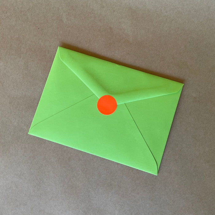 Wishing You A Bright Christmas Card's envelope with the fluoro red circle sticker