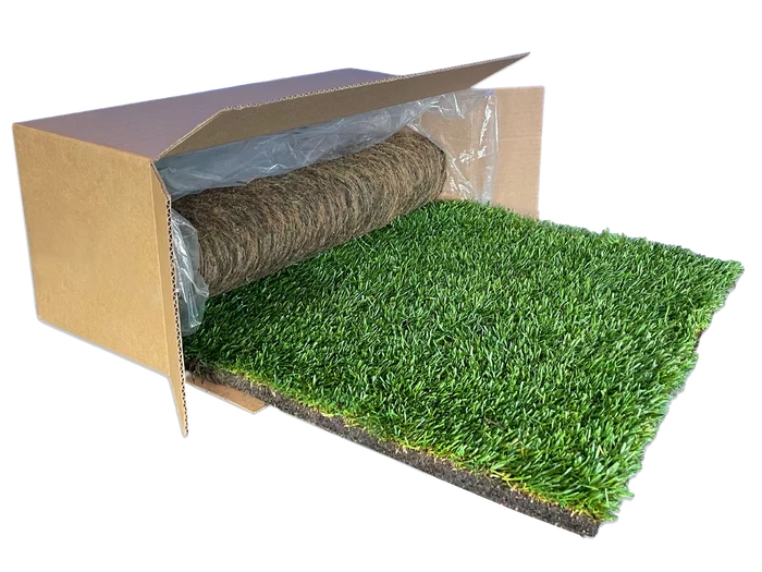 XL real dog grass pee pad unrolling from its shipping box, showing fresh green potty grass.
