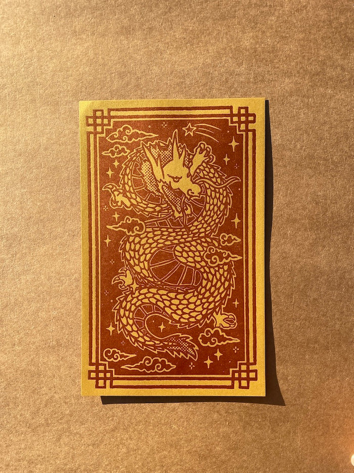 The Year of the Dragon print on a brown background