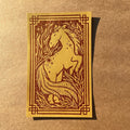 Bright Press x Banksia Creative's Year of the Horse print with a fiery horse design and decorative border on a brown textured background