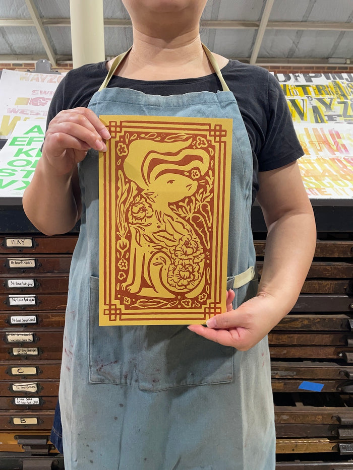 Ann's holding a Year of the Rabbit print in the print shop