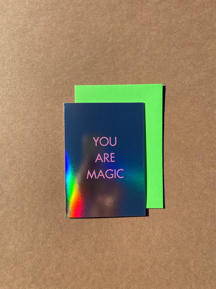 You Are Magic Card. Text reading "You Are Magic" printed on mega shiny card stock, so shiny, you can see Ann's arm in the reflection as she attempted to take the photo.